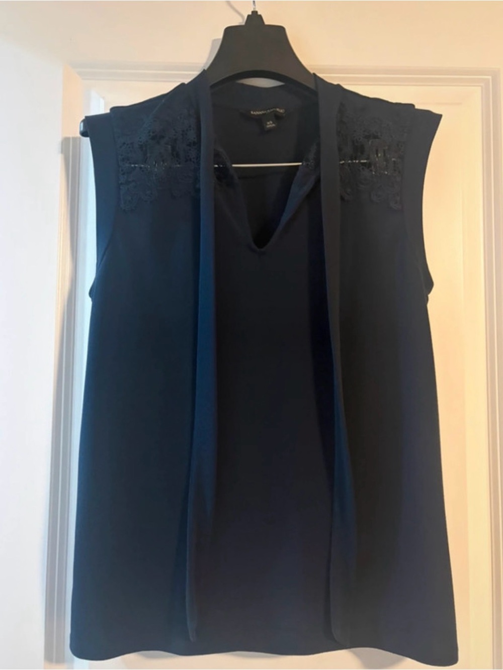 Banana Republic size XS navy blue sleeveless with lace and a neck tie.